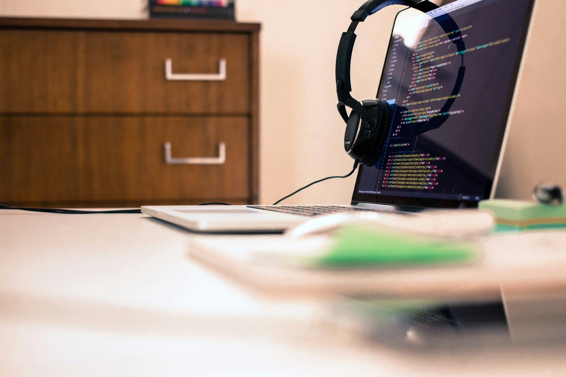 a laptop computer sitting on top of a desk